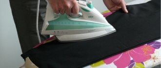 A man ironing his trousers