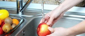 Washing an apple under running water